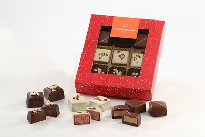 Confezione praline Natalizie  - Frutti rossi, Caramello, Arancia e cannella 100 g
