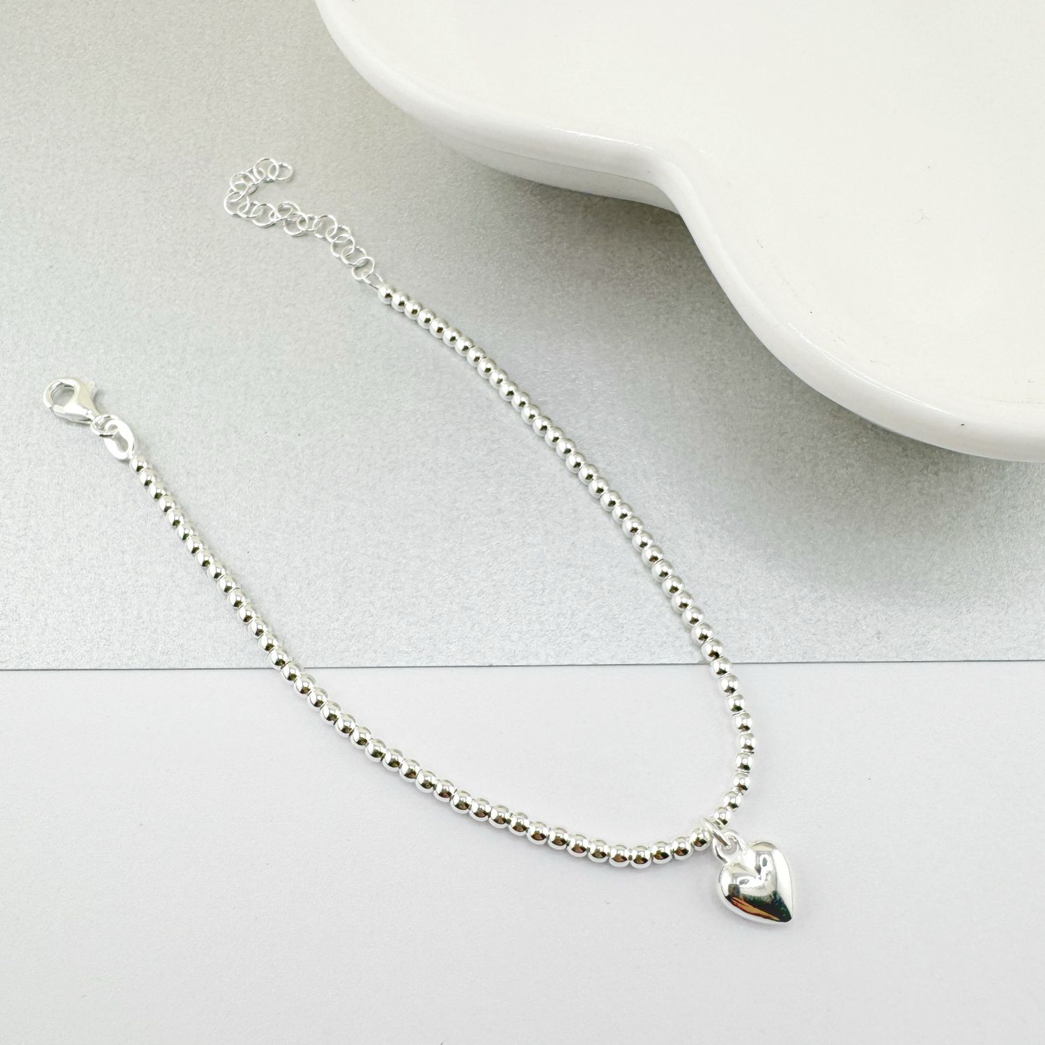 Pulsera bolitas con corazon