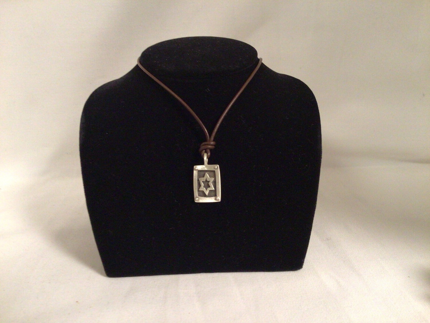 Star on Leather Cord