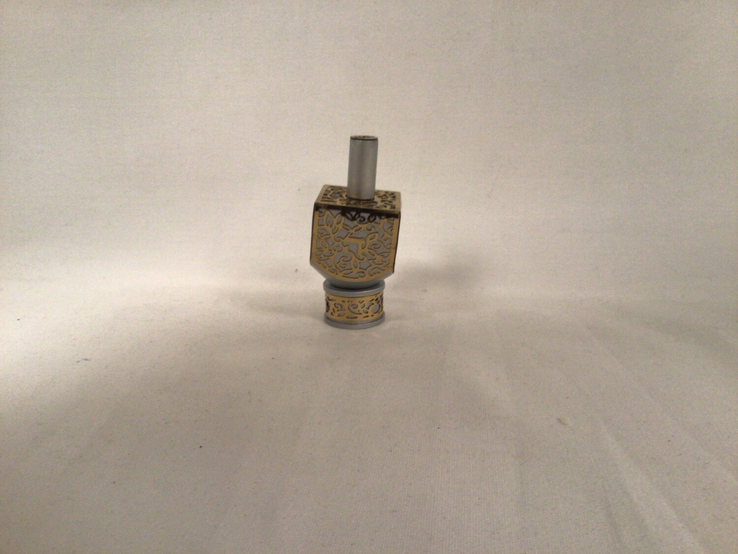 Anodized  Dreidel with Brass  Metal Cutout on  Stand