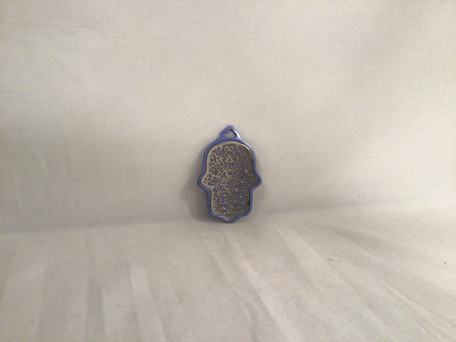Small Anodized Hamsa Wall Hanging with Pomegranate Cutouts on Blue