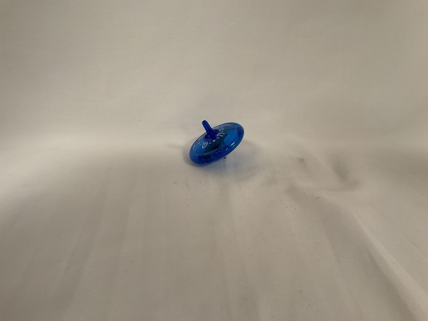 Blue and Silver Light Patterns on &quot;Light Up&quot; Dreidel Toy