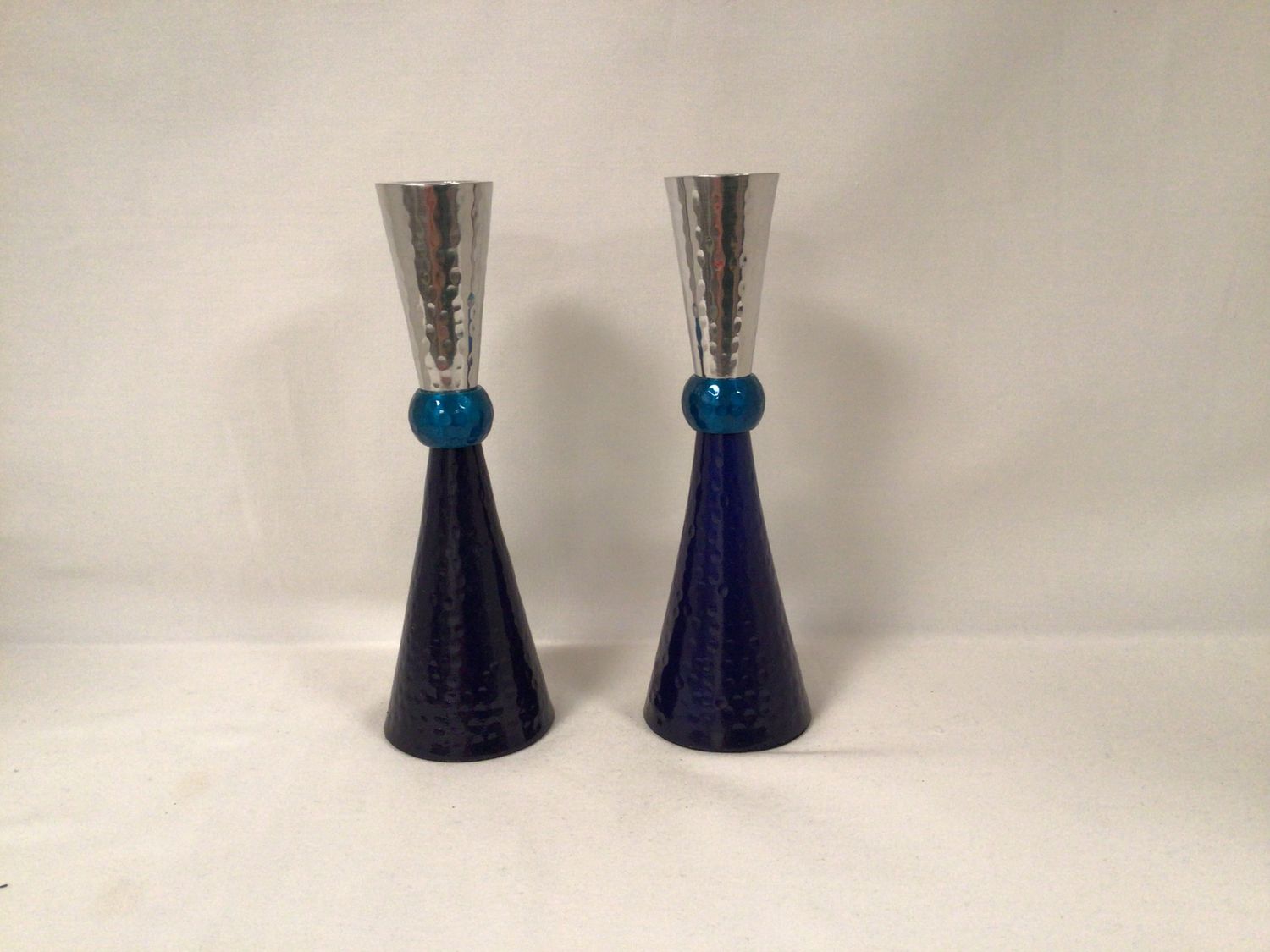 Anodized candlesticks with multi blue sections 