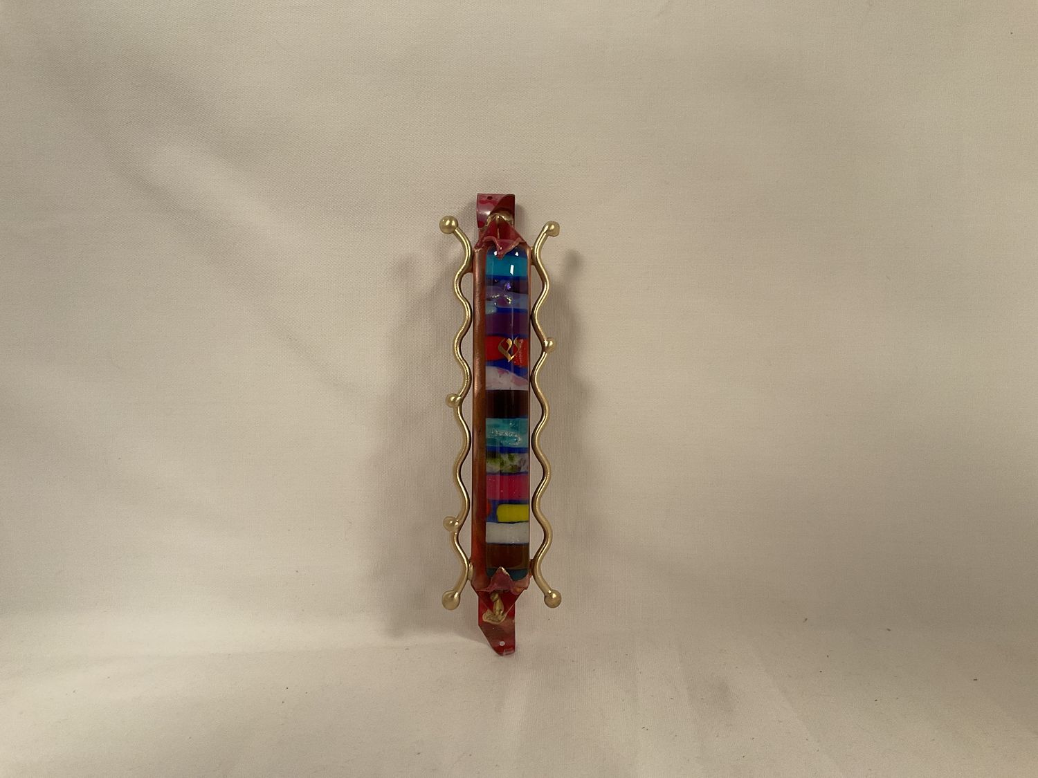Classic glass mezuzah with brass squiggle rods