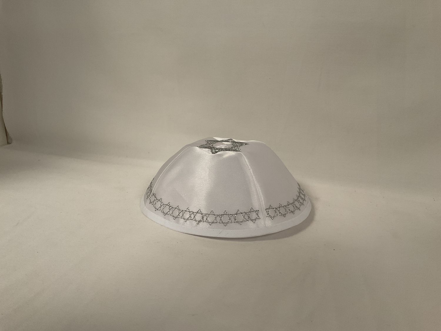 White Satin Kippah with Silver Stars of David Trim White Satin Kippah with Silver Stars of David Trim
