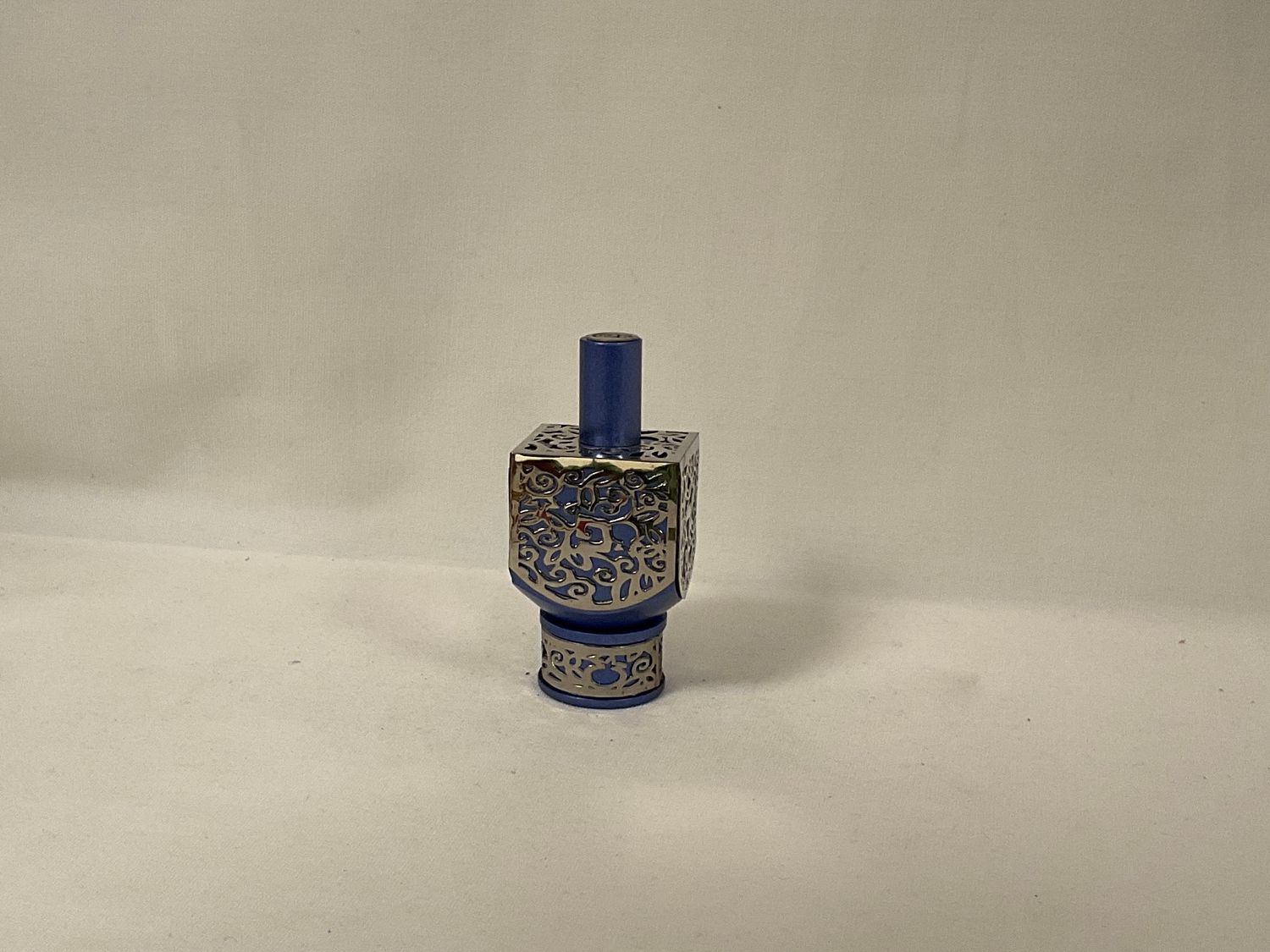 Anodized Blue Dreidel with Pomegranate Cutout Anodized Blue Dreidel with Pomegranate Cutout