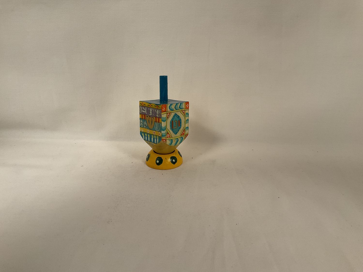 Colorful Painted Wood Dreidel on Stand Colorful Painted Wood Dreidel on Stand