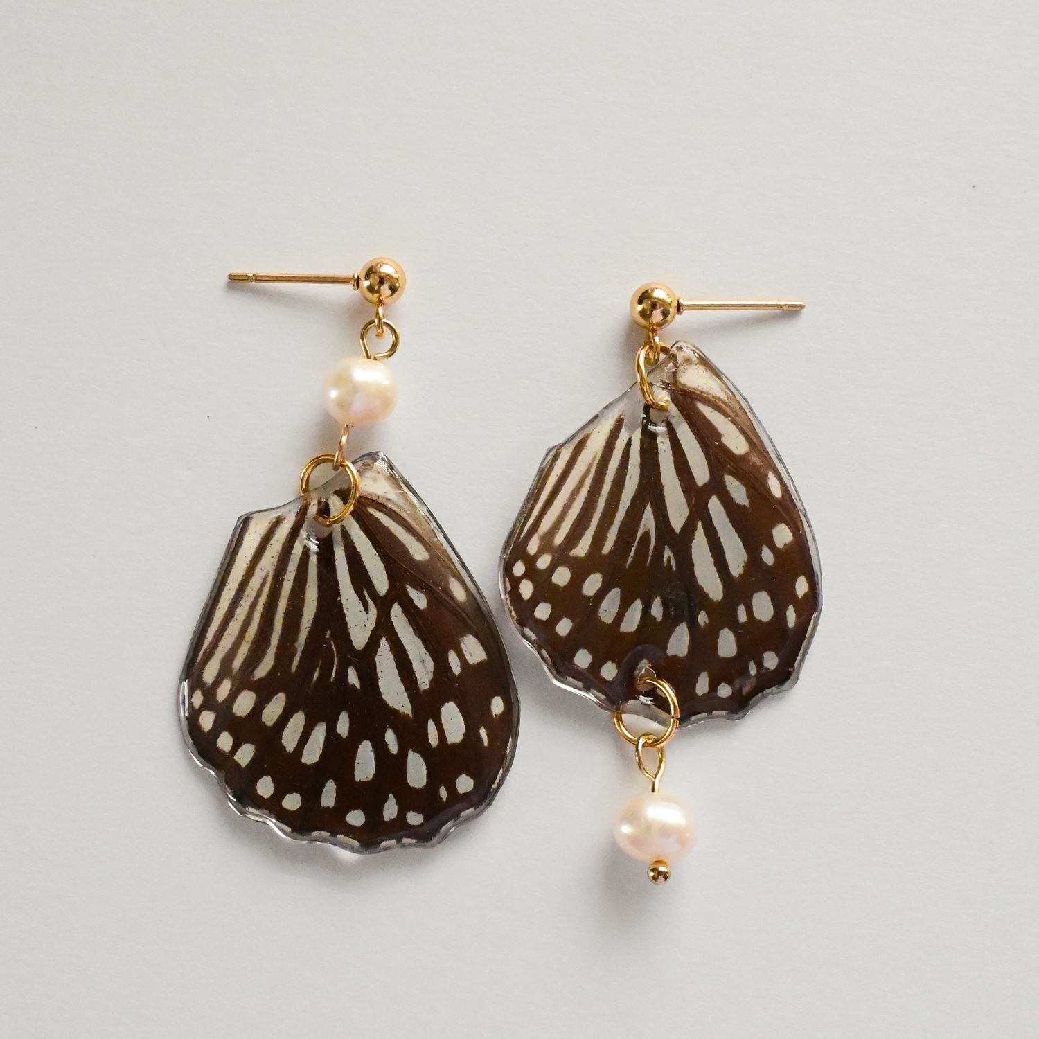 Butterfly wings with pearl earrings
