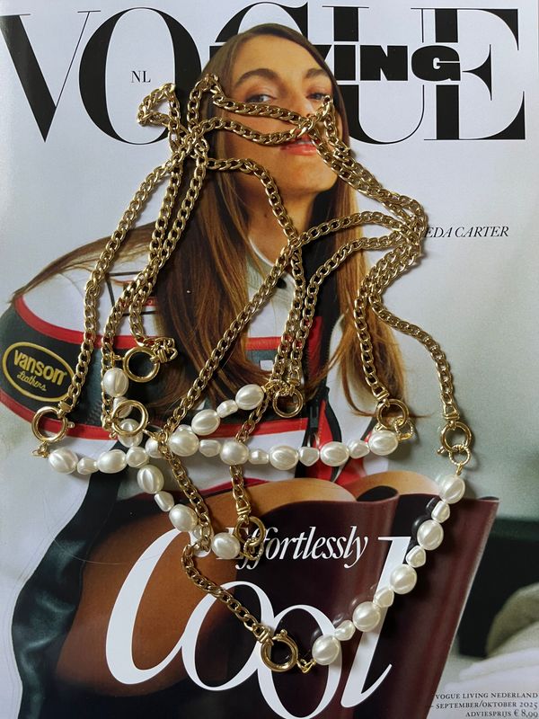 Gouden schakel ketting met parel tussenstuk