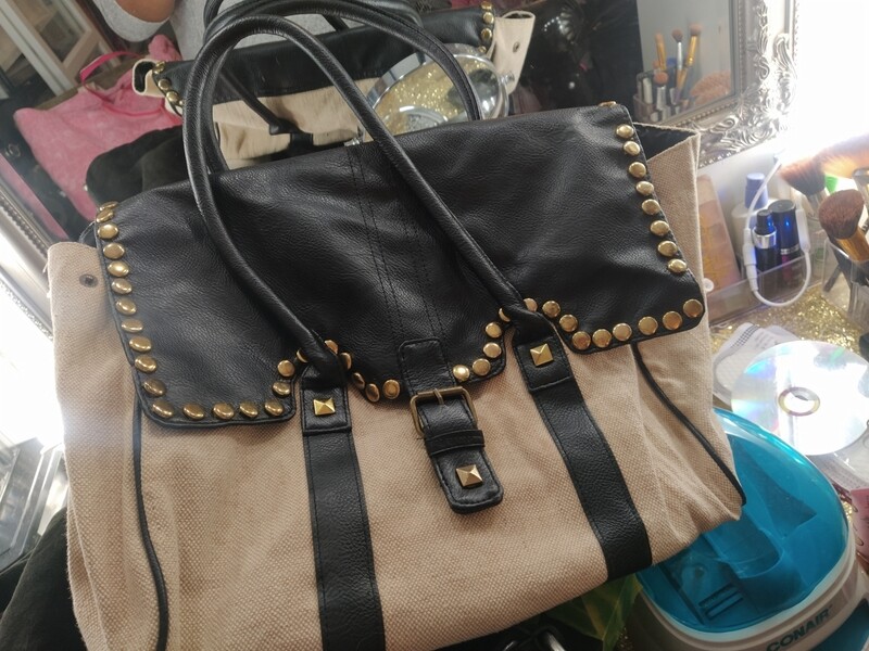 Used cream and black handbag with gold detailing