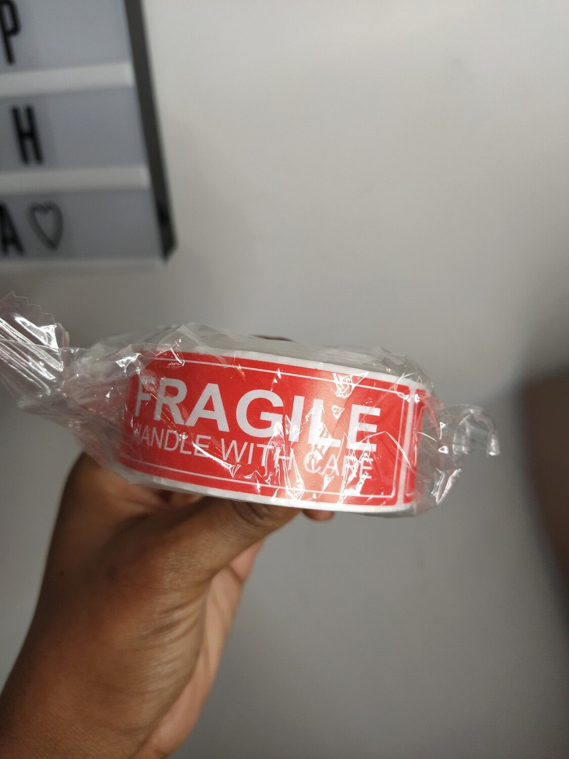 Roll of 100 red fragile stickers (ADD ON ITEM)