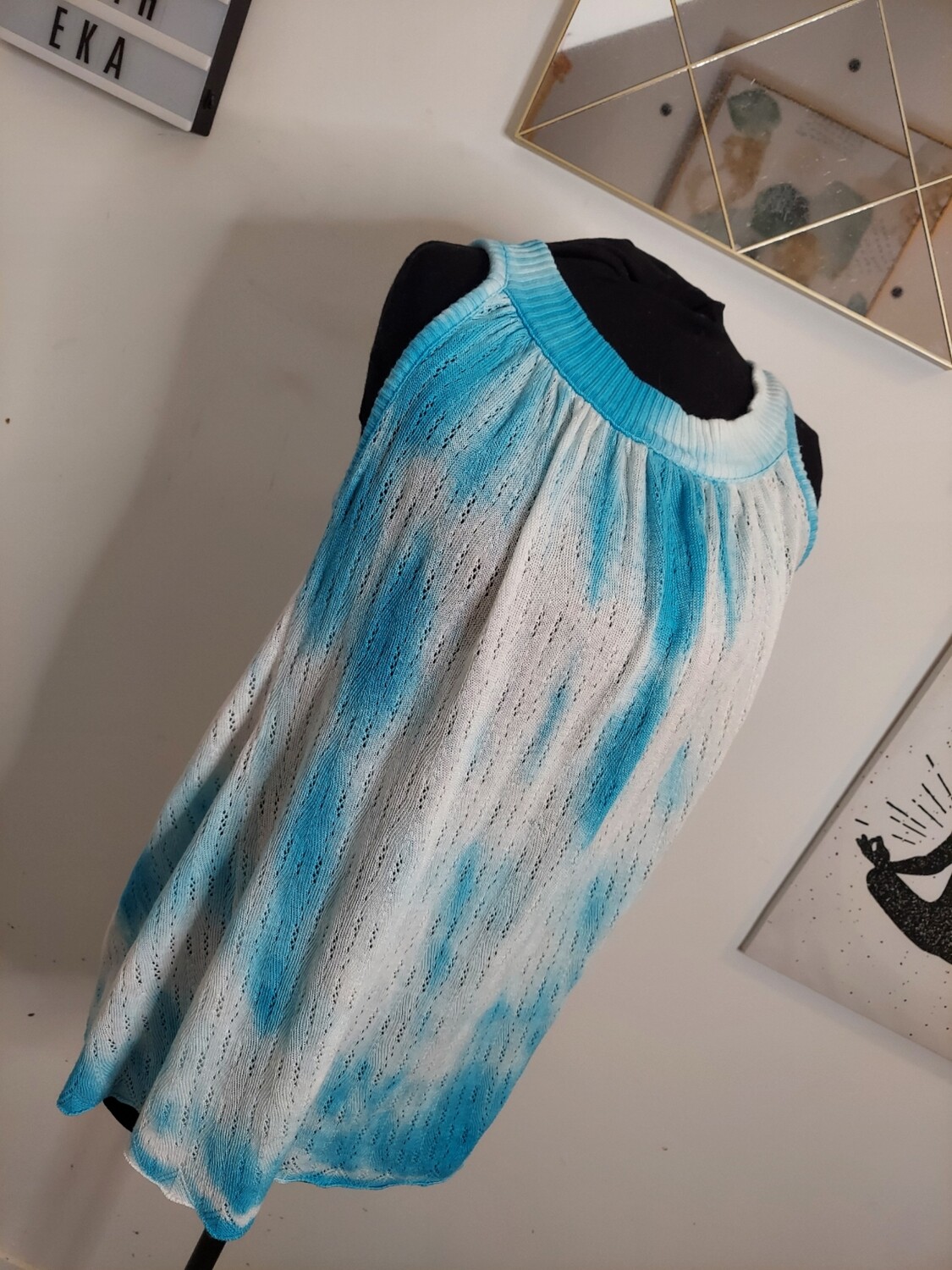 Used sky blue and white sleeveless shirt