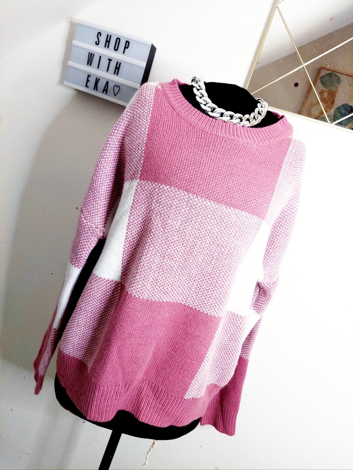 used pink and white sweater