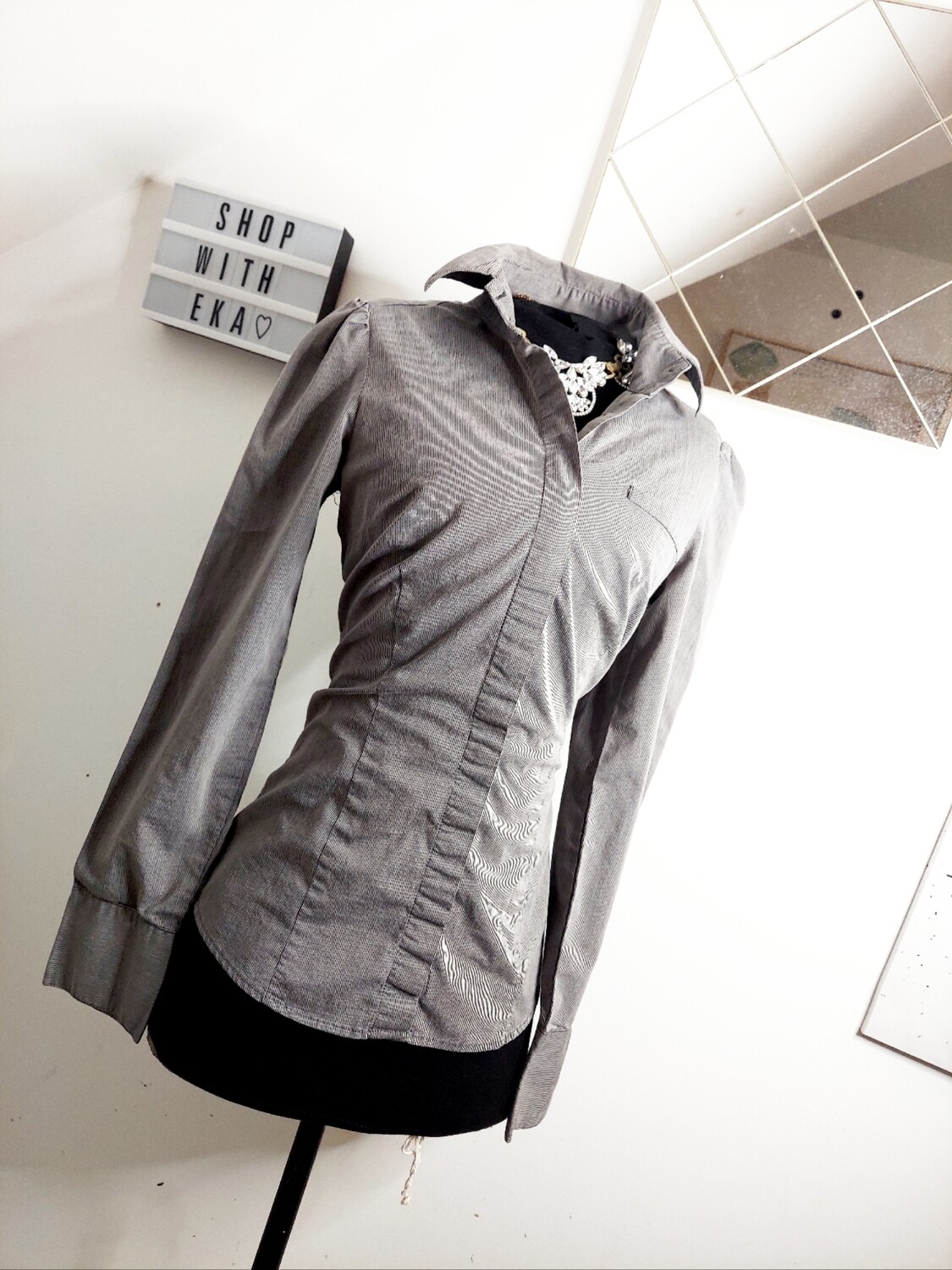 used grey button up shirt