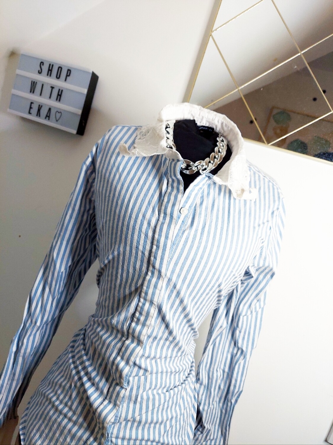 used blue and white button up shirt