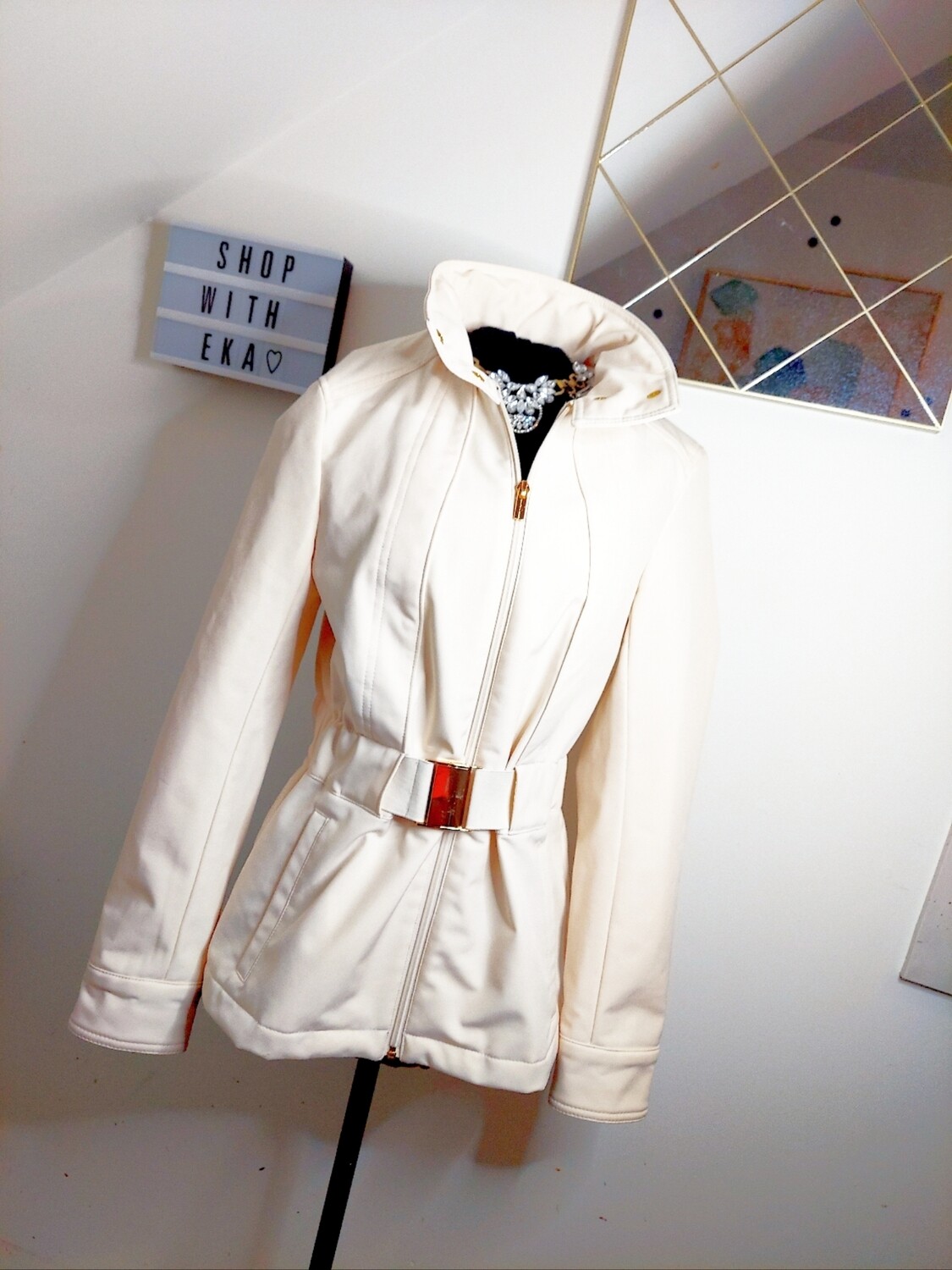 used cream zippy coat with gold hardware