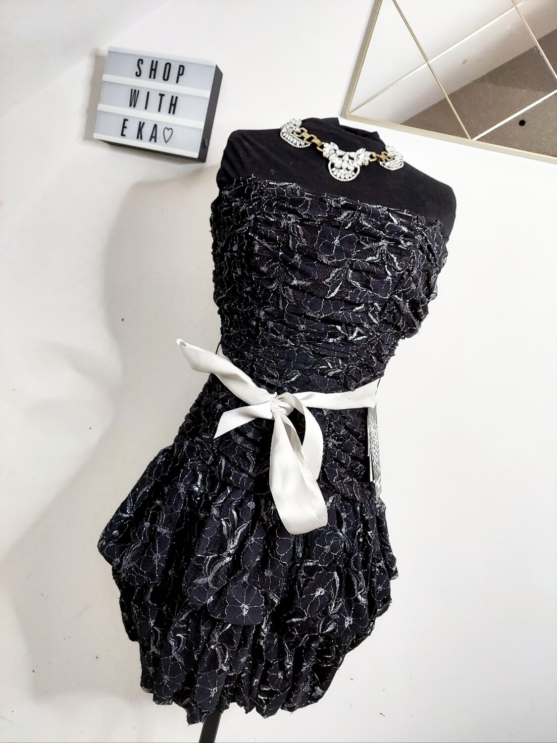 New black ruffle cocktail dress with silver accents