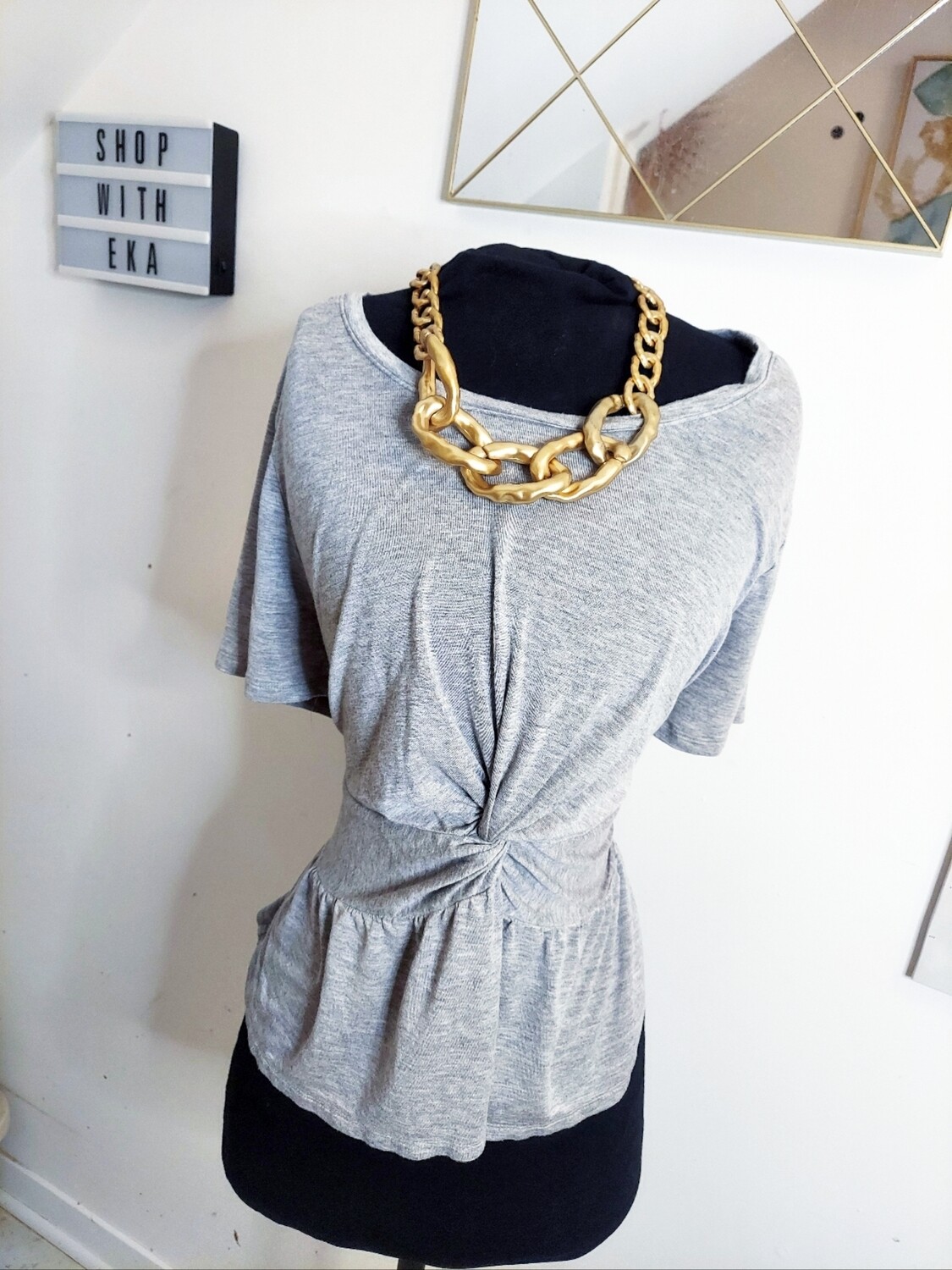 used grey short-sleeved top