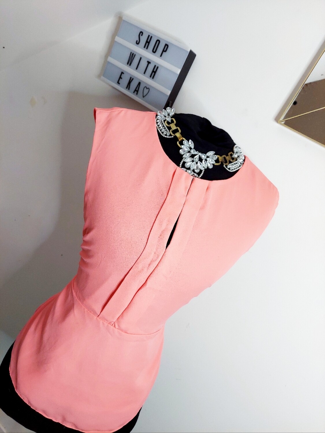used pink short-sleeved shirt