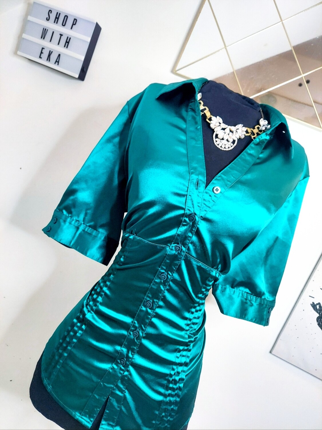 used green short-sleeved button up shirt