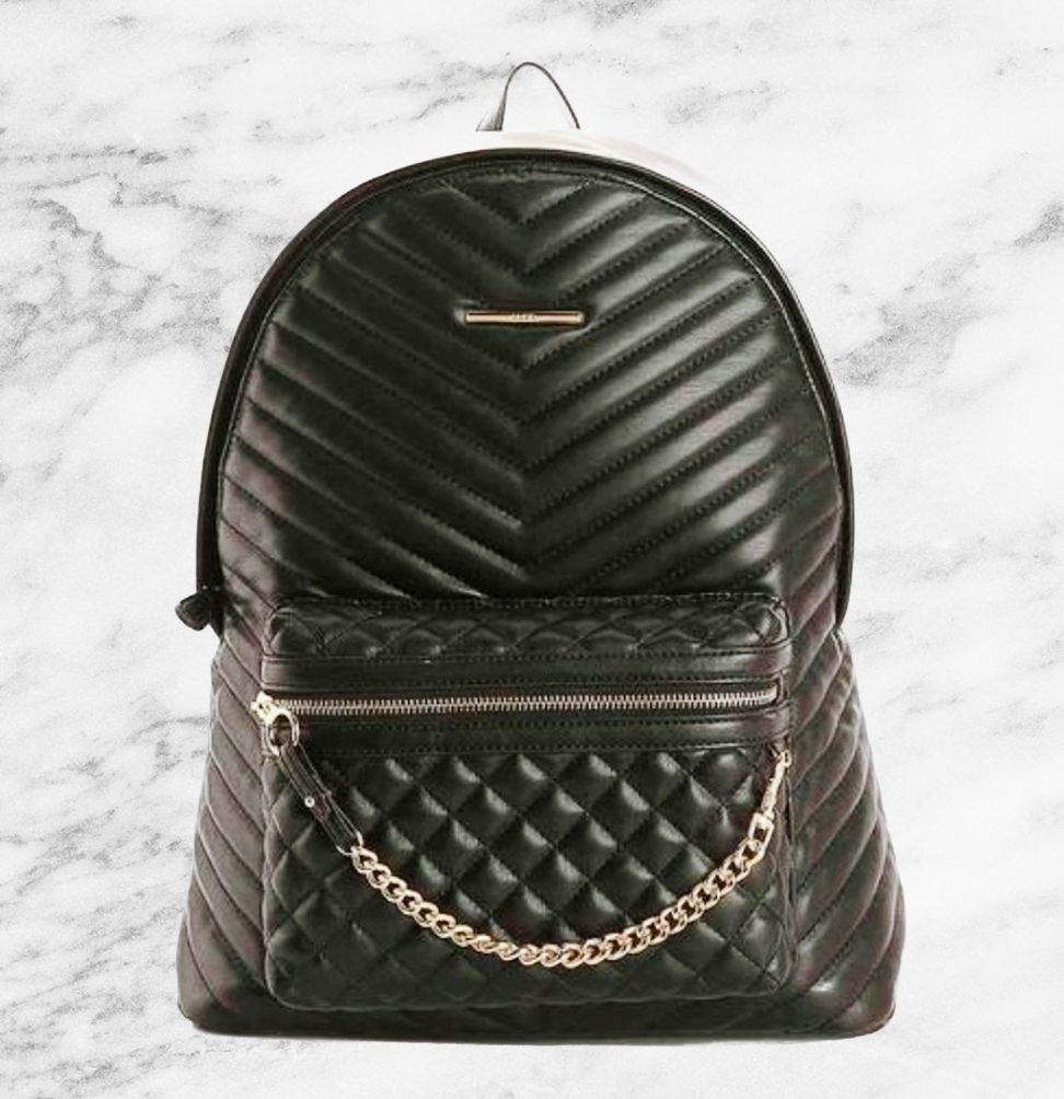 Black quilted backpack with gold hardware