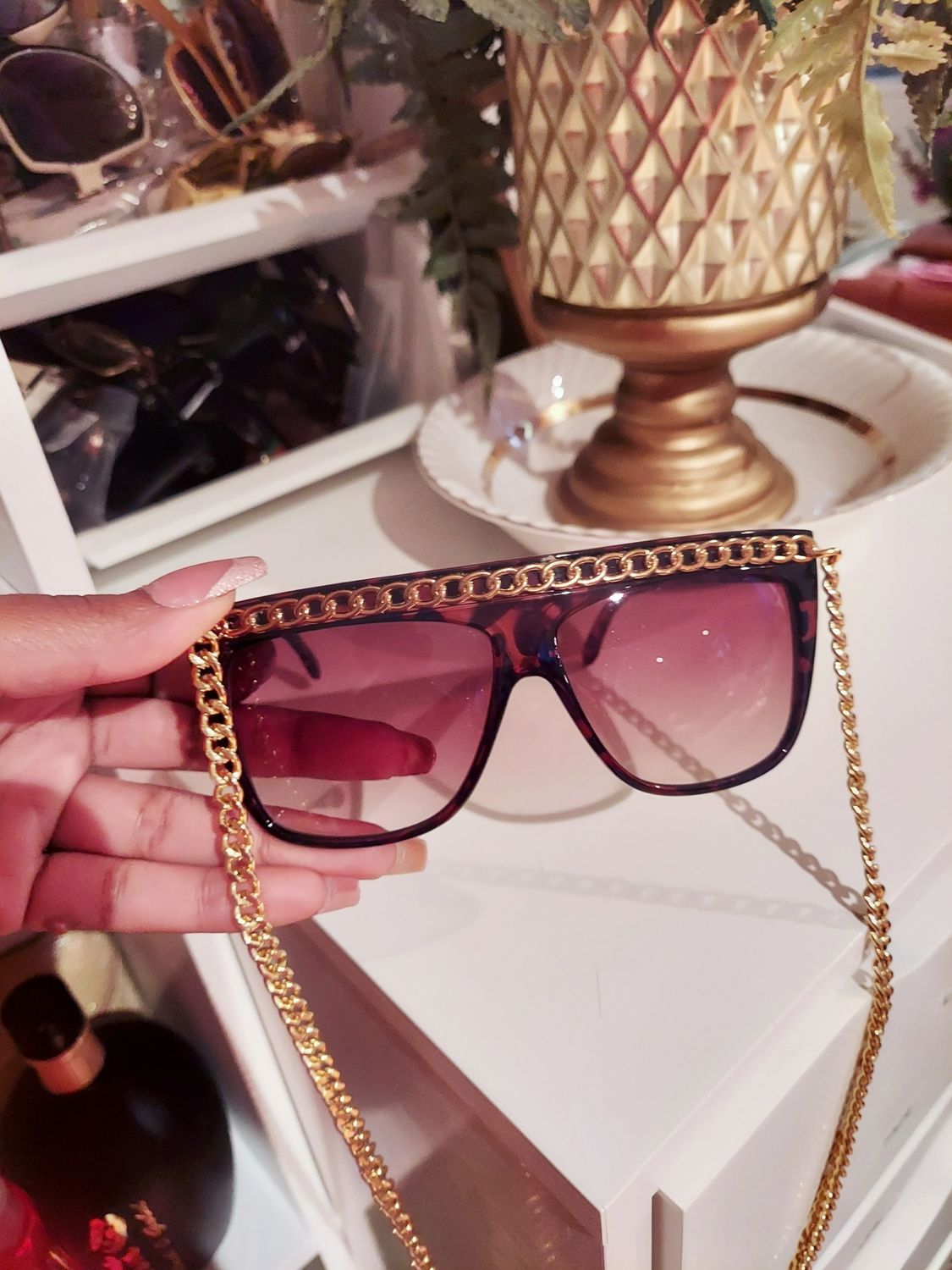 Brown sunglasses with gold chain