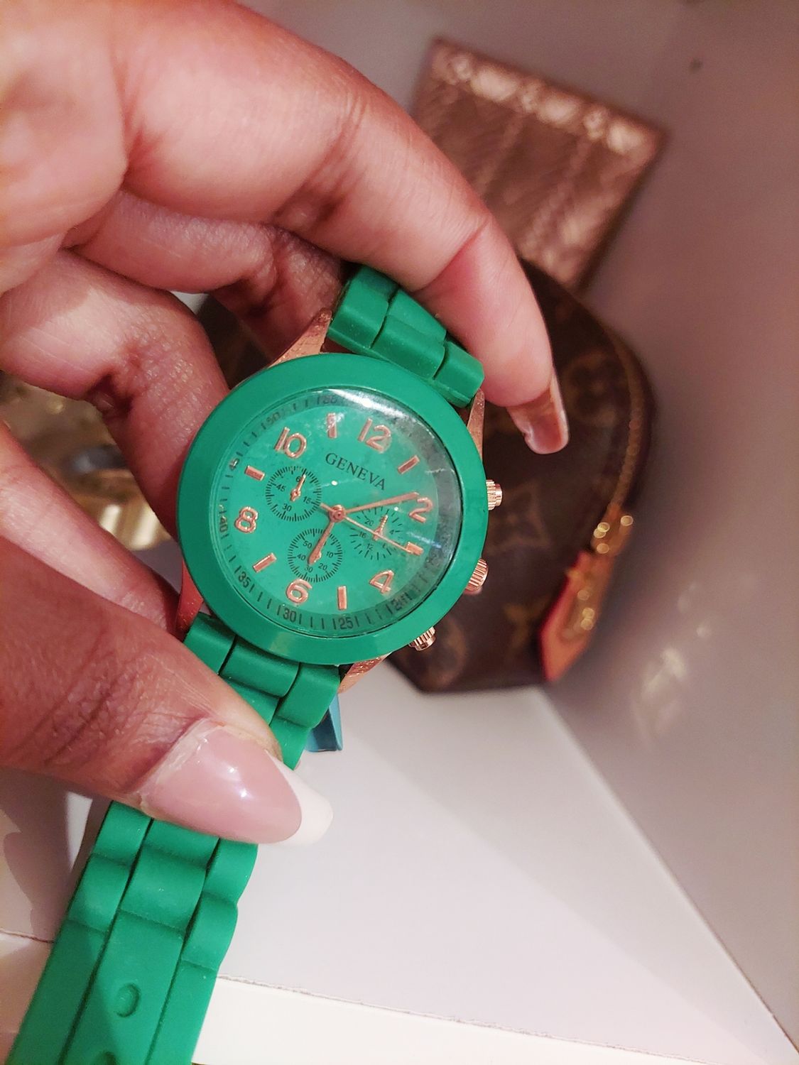 Used green and rose gold watch