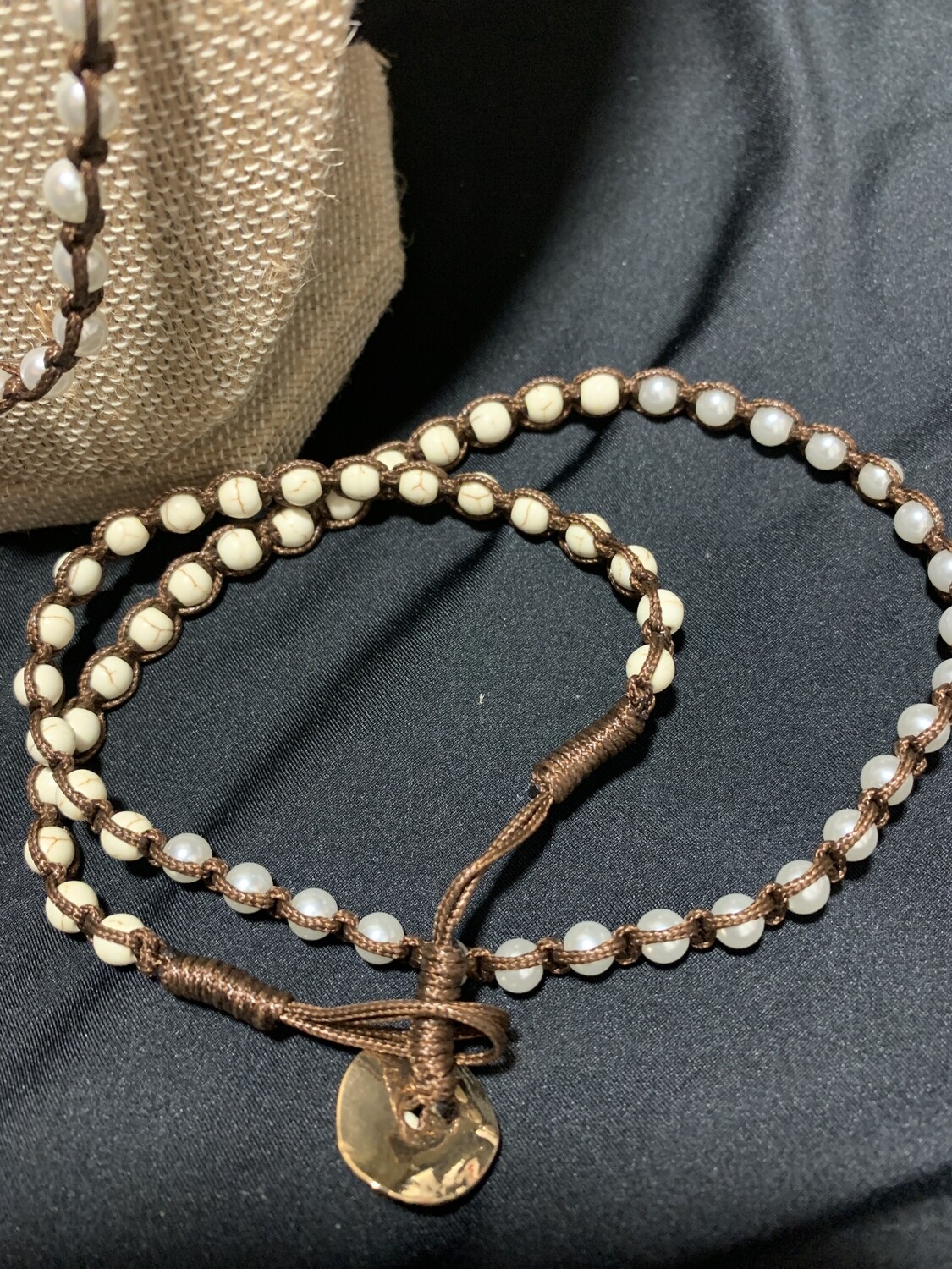 Hand made necklace with beaded synthetic  white cream pearls, dark brown strung craft work. 20 inch