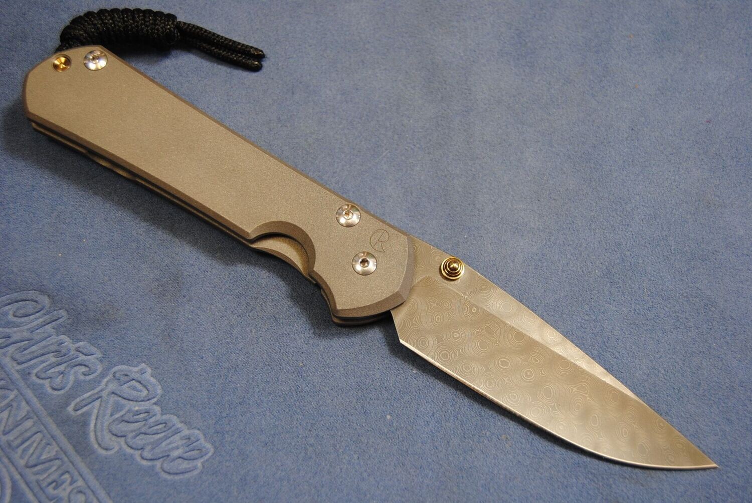 Large Sebenza 31 - Plain Drop Point - Left Hand-Raindrop Damascus-Double Gold Thumb Studs. Now Discontinued !