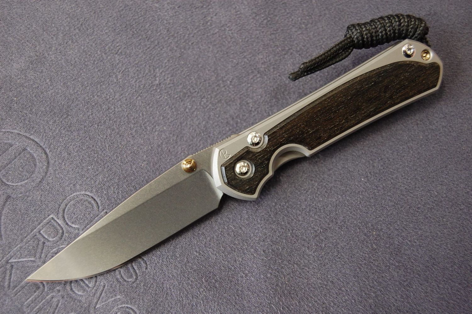 Small Sebenza 31 - Drop-Point Blade, Bog Oak Inlay, Glass-Blast Finish, Stonewashed Blade, Gold Hardware Small Sebenza 31 - Drop-Point Blade, Bog Oak Inlay, Glass-Blast Finish, Stonewashed Blade, Gold Hardware