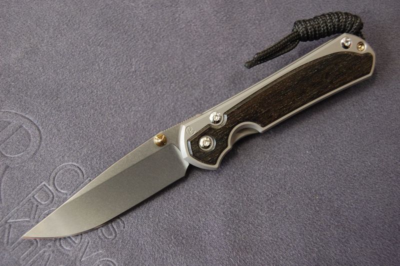 Small Sebenza 31 - Drop-Point Blade, Bog Oak Inlay, Glass-Blast Finish, Stonewashed Blade, Gold Hardware Small Sebenza 31 - Drop-Point Blade, Bog Oak Inlay, Glass-Blast Finish, Stonewashed Blade, Gold Hardware