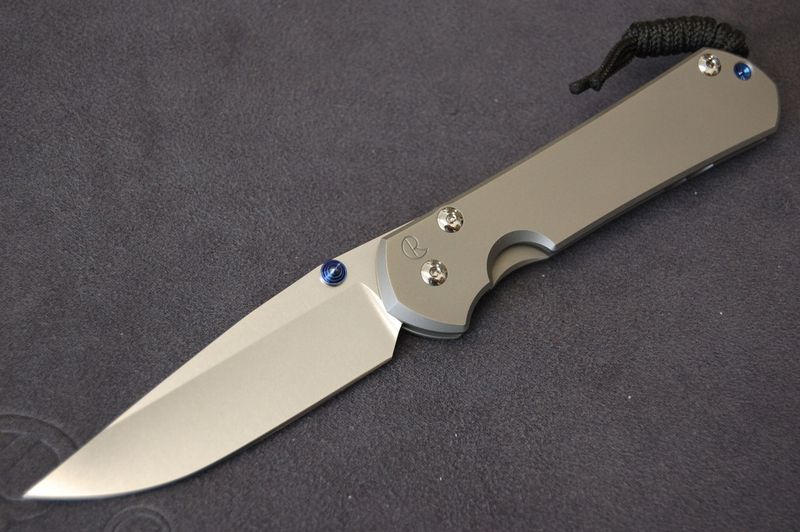 Large Sebenza 31-Plain Glass Blast-Drop Point Stonewashed Blade-Blue Hardware- Single Lug. Large Sebenza 31-Plain Glass Blast-Drop Point Stonewashed Blade-Blue Hardware- Single Lug.