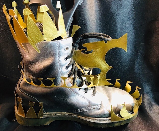 Jagged edged Brass metal Shoe/self diffence -John Crutchfield