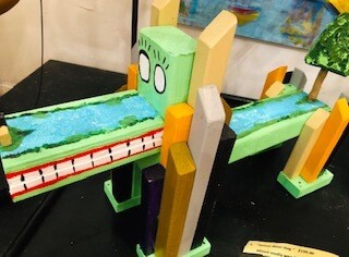 Hand constructed wooden dogs created with

recycled wood strips and painted by Rusty Door from N.C..