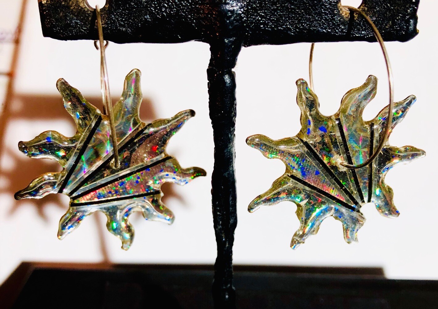 Sunburst Spinning Earrings

graphics on metal holograms