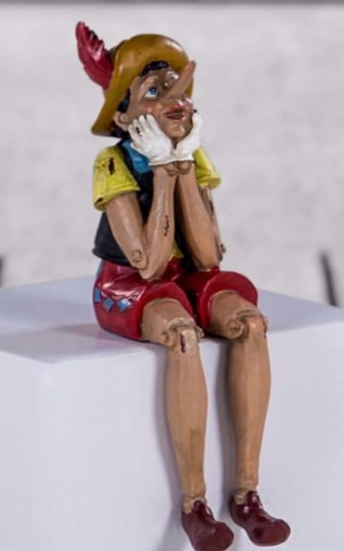 Antiqued Pinocchio Sitting