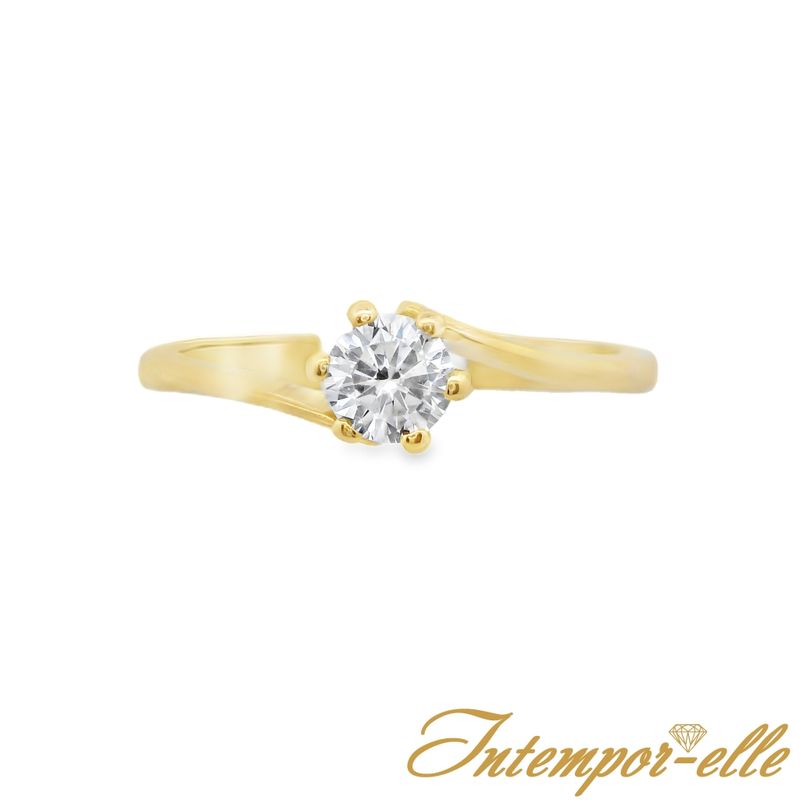 Bague solitaire or 18 carats et zirconium