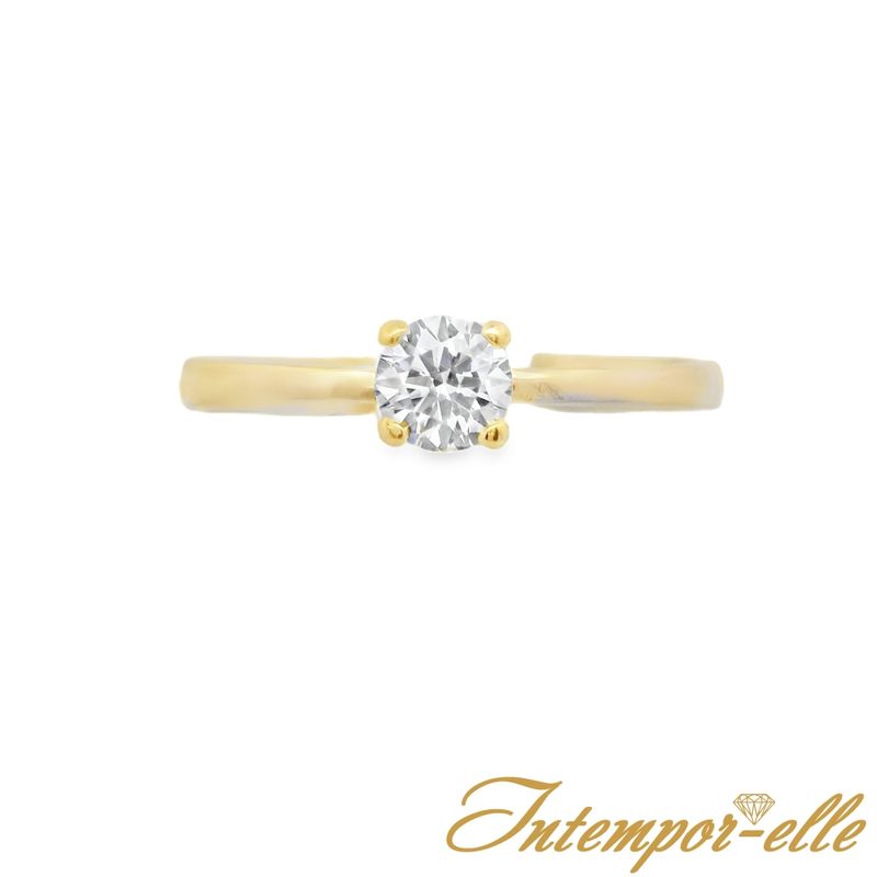 Bague solitaire or 18 carats et zirconium