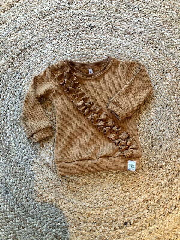 Sweater met diagonale ruffel