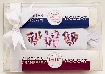 One soft caramel toffee, beautifully wrapped and packaged in Love themed wrapper with two assorted luxury nougats, packaged in a gift box with ribbon. One soft caramel toffee, beautifully wrapped and packaged in Love themed wrapper with two assorted luxury nougats, packaged in a gift box with ribbon.