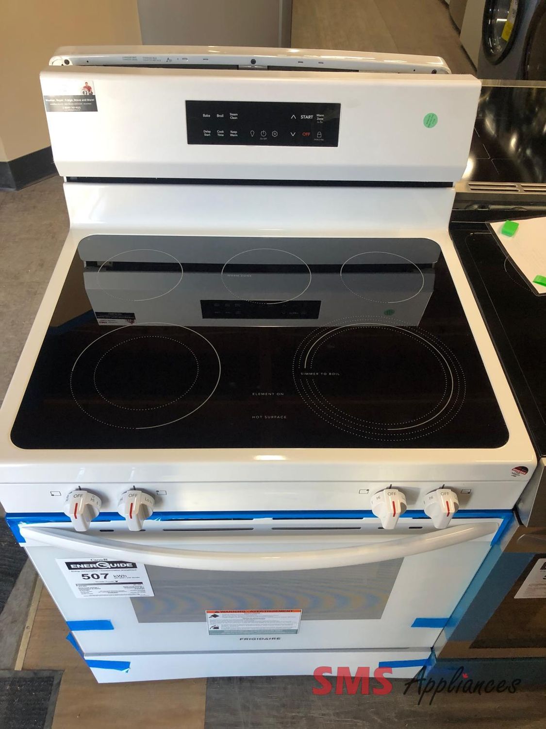 Open Box Glass Top Stove Frigidaire with the Even  Temp FCRE306CAW