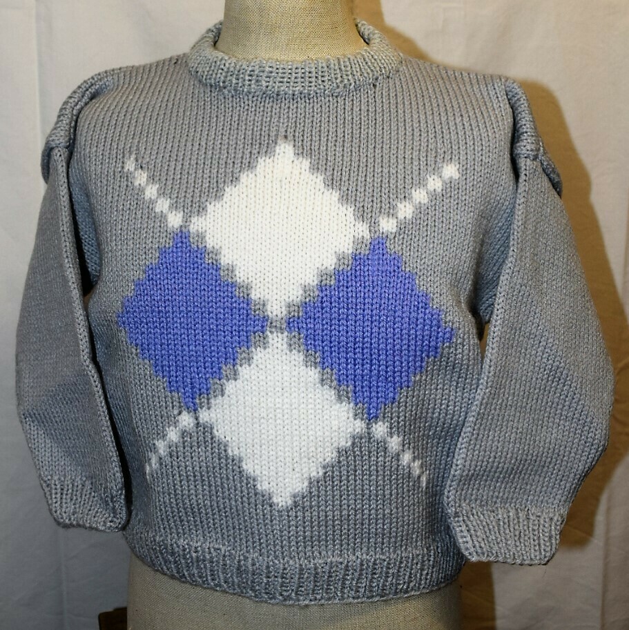 Losange bleu et blanc sur fond gris