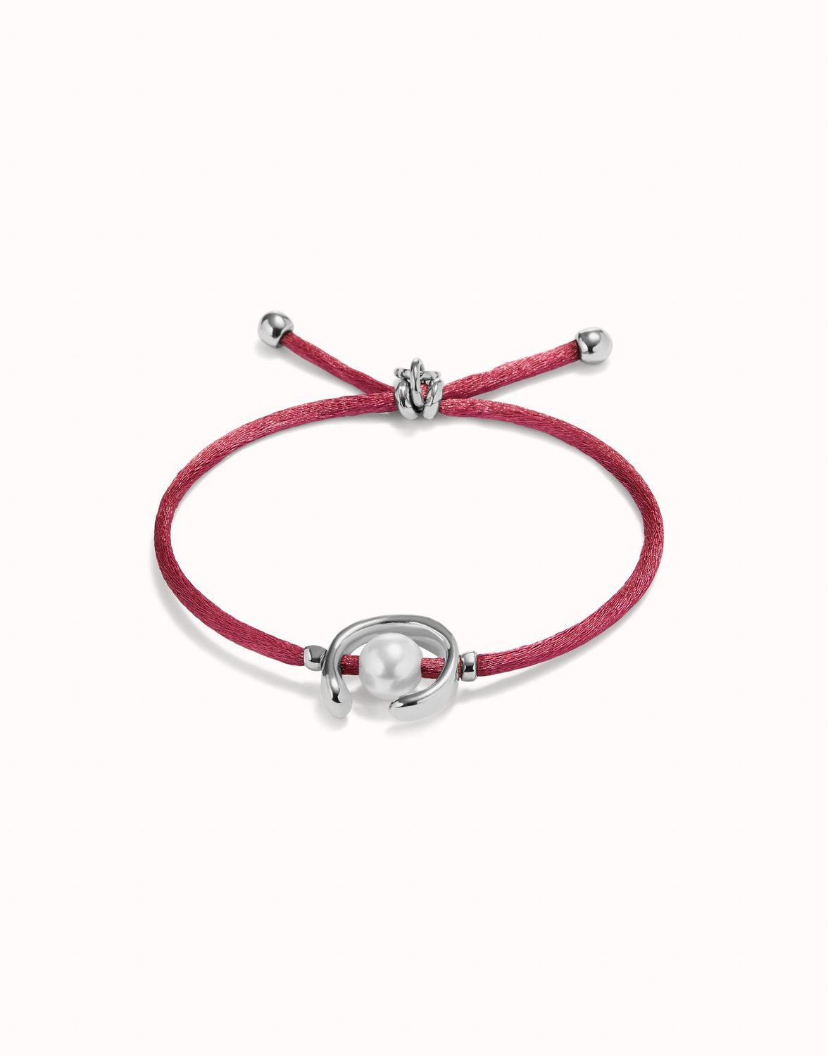 Pulsera de hilo malva con perla shell fornitura bañada en plata de ley.