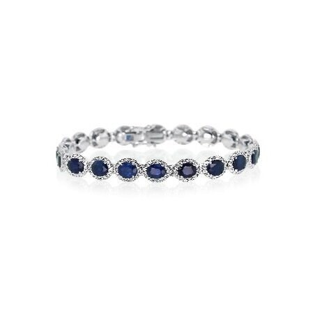 18kt White Gold - Oval Blue Sapphire: 14.14ct - White Round Diamond: 1.79ct