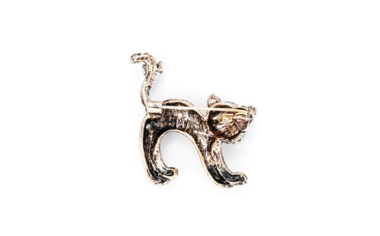 Broche kat wit