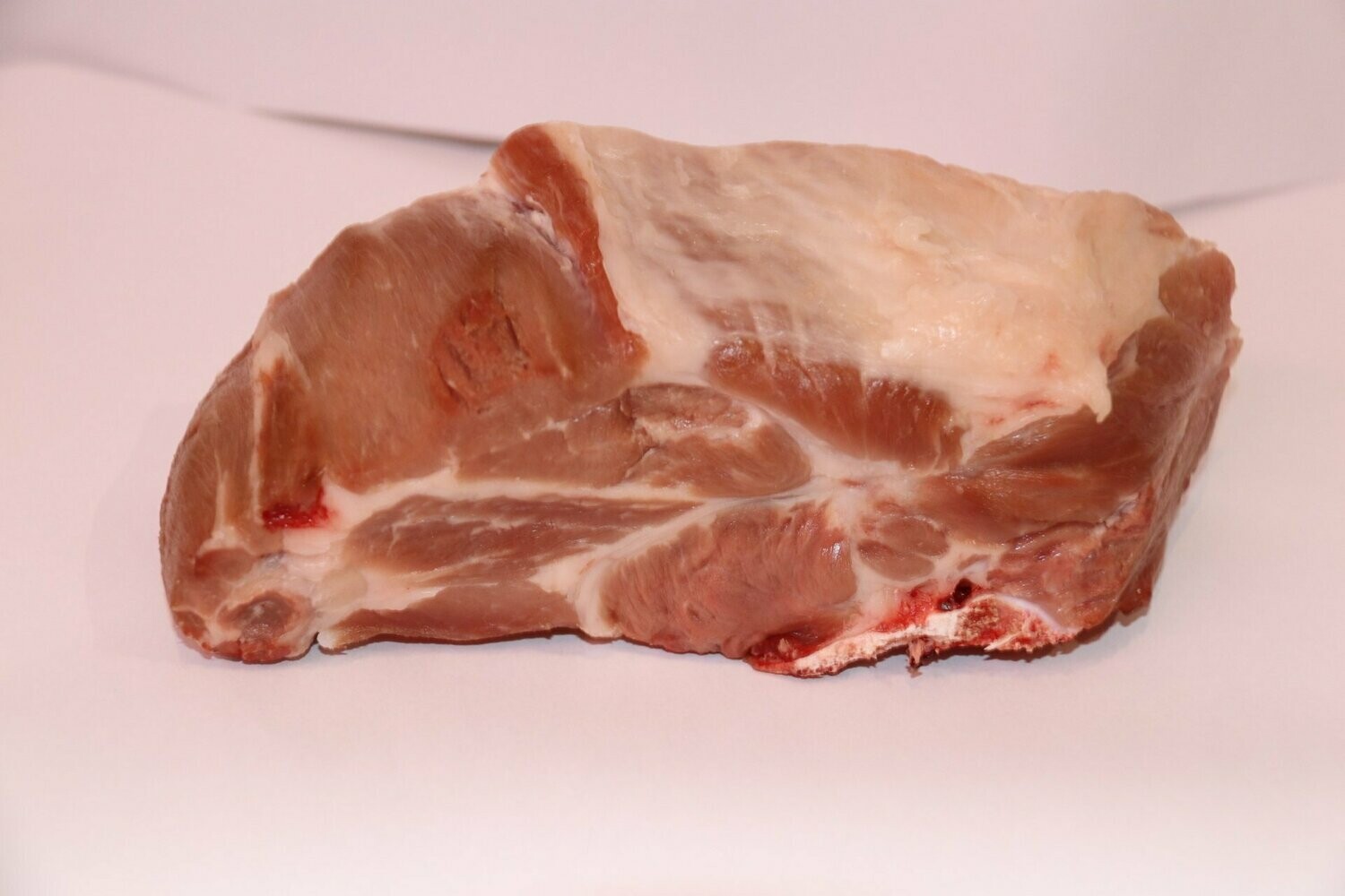 Rôti de porc dans l'échine avec os (environ 500gr)