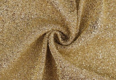 Decorative shimmering fabric with a metallic shiny surface- Gold