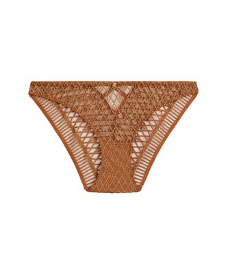 Italian slip uit de Aubade Stardust-collectie in de kleur Ambergold, close-up van de verfijnde borduursels en luxueuze details.