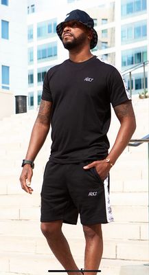 Ensemble sport -Aïbo- couleur Noir / bande blanche / motif : symbole