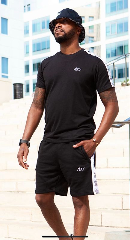 Ensemble sport -Aïbo- couleur Noir / bande blanche / motif : symbole